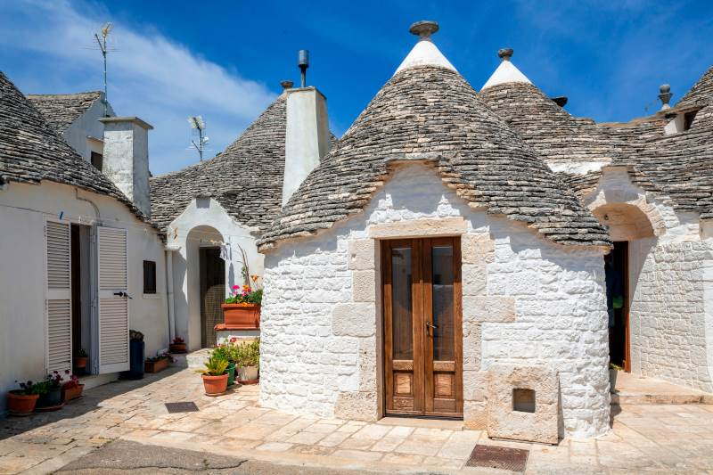 typical Trulli houses in UNESCO district of Alberobello Puglia Italy